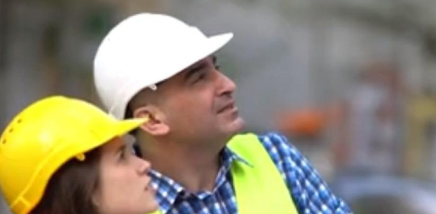 Female apprentice learning from boss