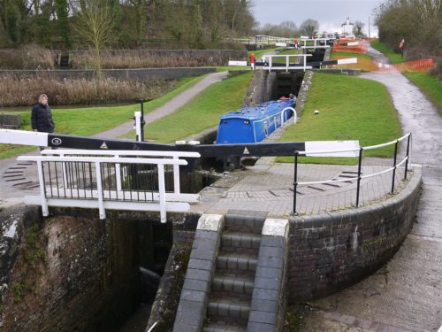 A canal boat goes through Foxton Locks