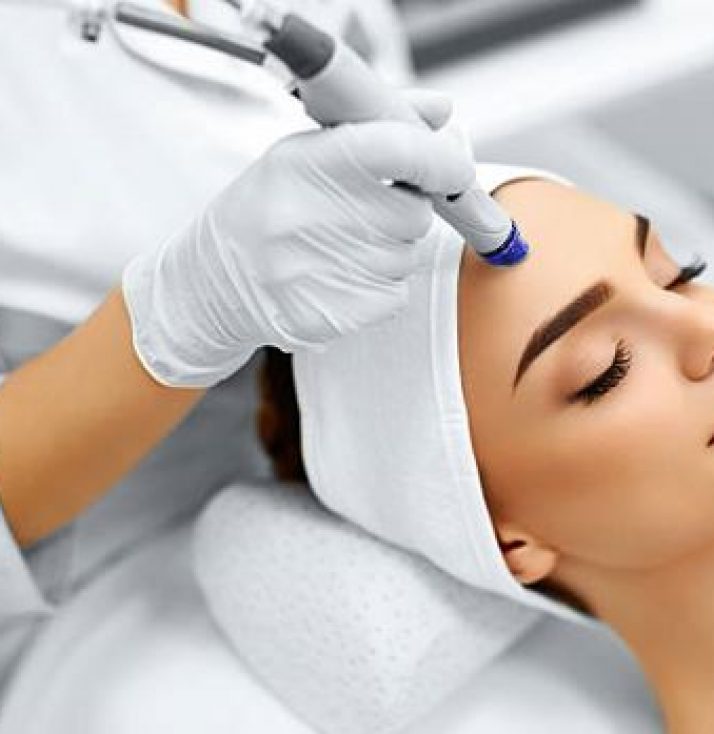 A person lying down having a skin beauty treatment