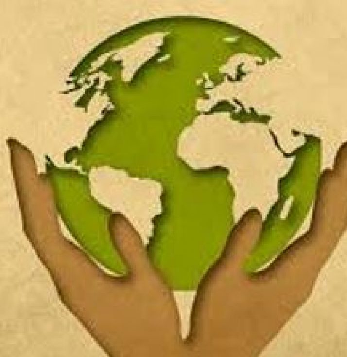 A clean Green Earth held in raised hands